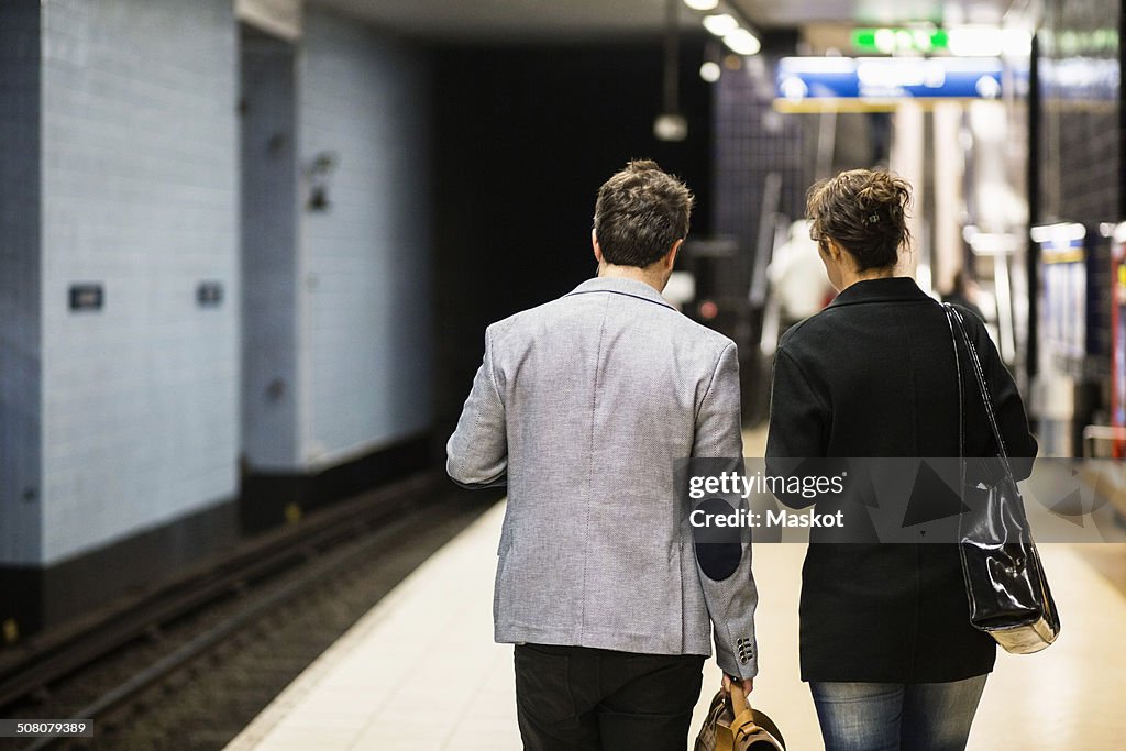 Rear view of business people waiting at subway station