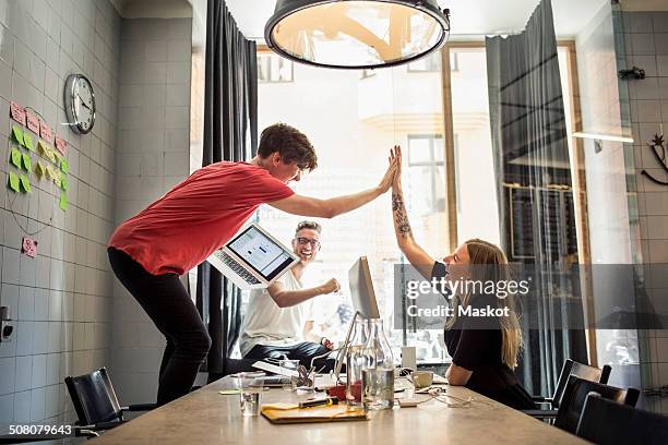 successful team of new business people in creative office - creación fotografías e imágenes de stock