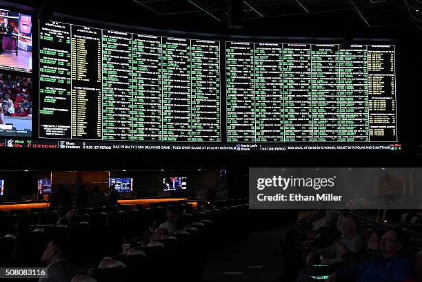 The betting line and some of the nearly 400 proposition bets for Super Bowl 50 between the Carolina Panthers and the Denver Broncos are displayed at...