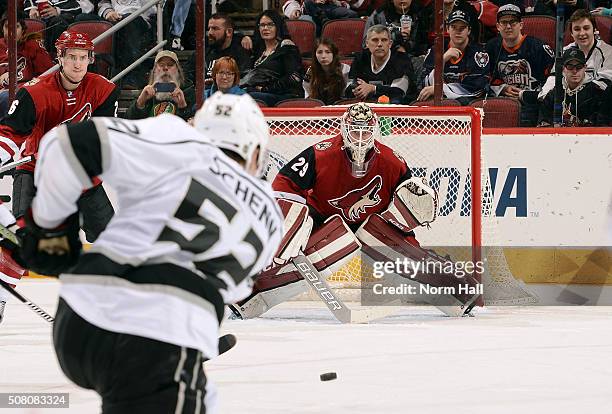 Goalie Anders Lindback of the Arizona Coyotes looks to make a save on the shot by Luke Schenn of the Los Angeles Kings during the third period at...