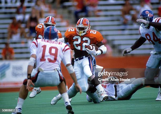 Running back Emmitt Smith of the Florida Gators runs with the ball during a game against the Ole Miss Rebels at Ben Hill Griffin Stadium on September...