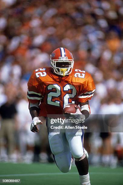 Running back Emmitt Smith of the Florida Gators runs with the ball during a game against theVanderbilt Commodores at Ben Hill Griffin Stadium on...