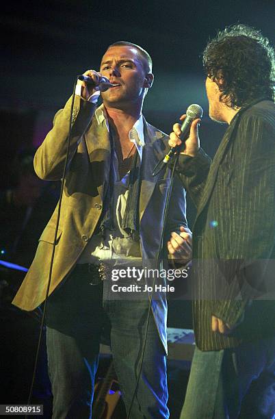 Zucchero performs on stage with Ronan Keating at a benefit show in aid of the United Nations' UNHCR refugees fund, at The Royal Albert Hall on May 6,...