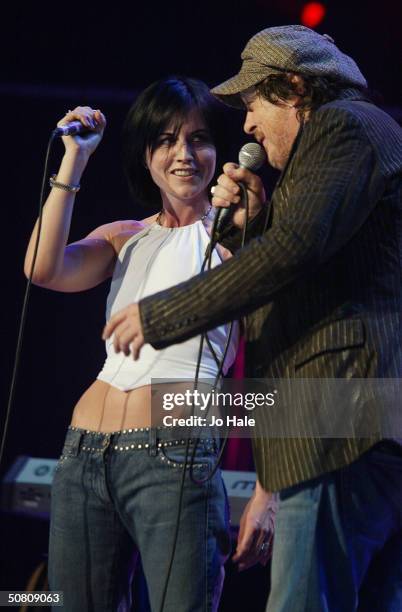 Zucchero performs on stage with Dolores O'Riordan of The Cranberries at a benefit show in aid of the United Nations' UNHCR refugees fund, at The...