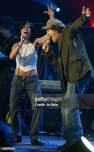 Zucchero performs on stage with Dolores O'Riordan of The Cranberries at a benefit show in aid of the United Nations' UNHCR refugees fund, at The...