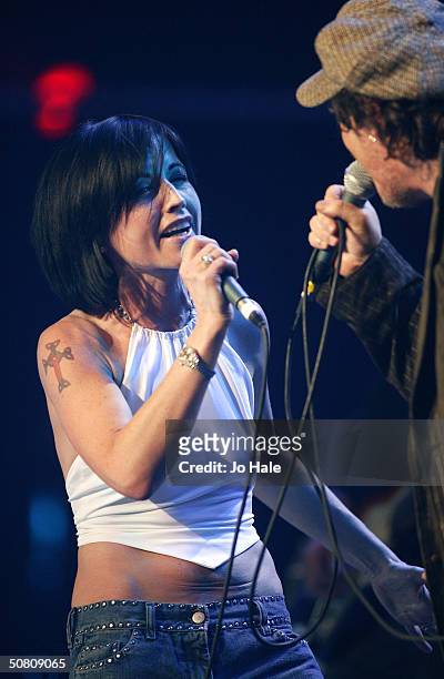 Zucchero performs on stage with Dolores O'Riordan of The Cranberries at a benefit show in aid of the United Nations' UNHCR refugees fund, at The...