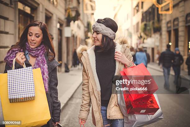 women shopping during sales in rome, italy - via condotti stock pictures, royalty-free photos & images