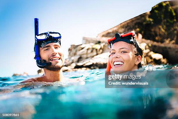 couple snorkeling - snorkeling stock pictures, royalty-free photos & images