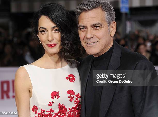 Amal Clooney and George Clooney arrive at the premiere of Universal Pictures' "Hail, Caesar!" at Regency Village Theatre on February 1, 2016 in...