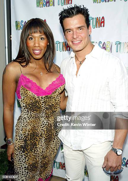 Actress Brown Sugar and actor Antonio Sabato Jr. Pose at the premiere of "Wasabi Tuna" at the Laemmle Sunset 5 Theatre on May 6, 2004 in Los Angeles,...