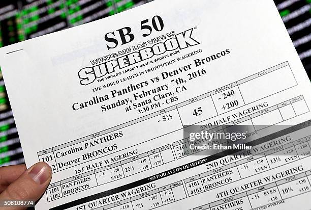 Betting sheet for Super Bowl 50 between the Carolina Panthers and the Denver Broncos is displayed at the Race & Sports SuperBook at the Westgate Las...