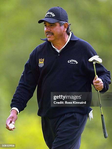 Eduardo Romero of Argentina after his putt on the par three 18th hole during the second round of the Daily Telegraph Damovo British Masters on the...