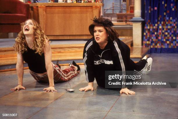 American pop singer Madonna and television show host and actress Rosie O'Donnell excercise together on an epsiode of 'The Rosie O'Donnell Show,' New...