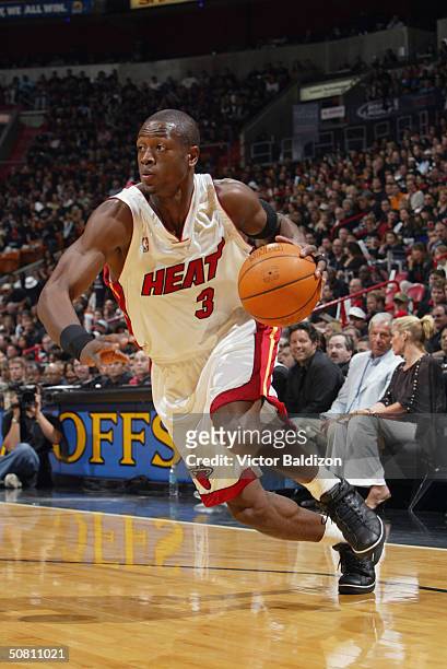 Dwyane Wade of the Miami Heat drives to the hoop in Game one of the Eastern Conference Quarterfinals during the 2004 NBA Playoffs against the New...