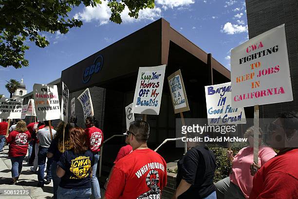 Telephone employees and members of the Communications Workers of America union picket in front of an SBC facility on May 7, 2004 in the Los Angeles...
