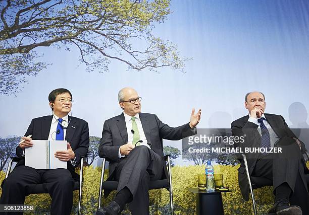 Michel Demare , Chairman of Swiss farm chemicals giant Syngenta speaks next to Chinese Ren Jianxin, Chairman of ChemChina and Syngenta chief...