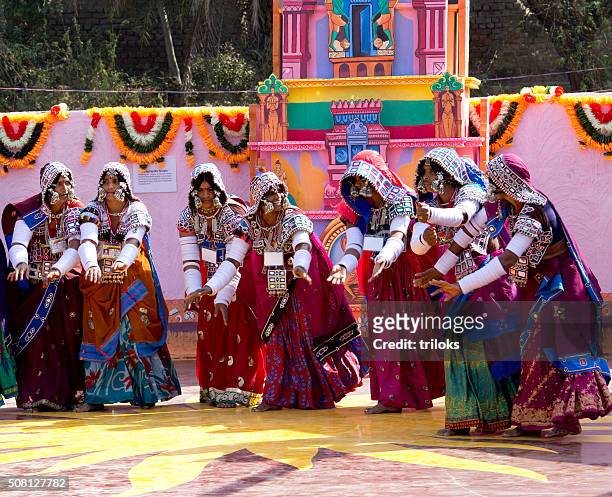 folk dancers performing dance in fair, surajkund, faridabad, haryana, india - rajasthan dance stock pictures, royalty-free photos & images