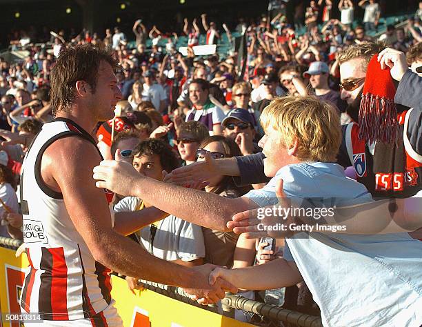 Aaron Hamill of the Saints celebrates with supporters after the round seven AFL match between the Fremantle Dockers and St Kilda at Subiaco Oval May...