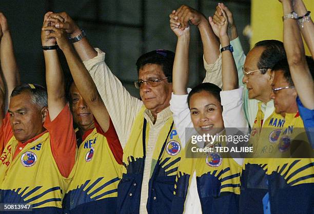 Popular Philippine movie star and opposition presidential candidate Fernando Poe together with his running mate, Senator Loren Legarda and senatorial...
