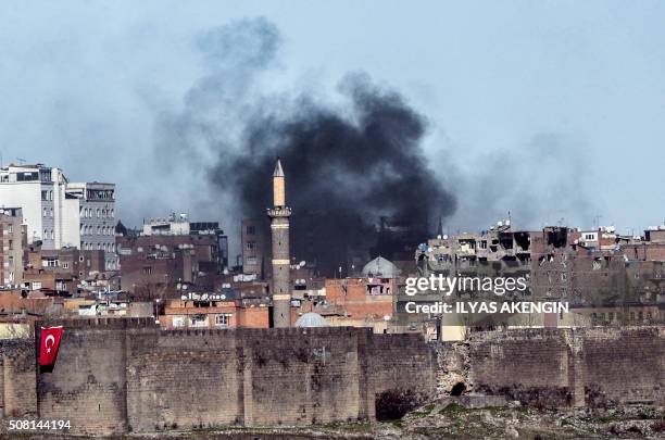 Photo taken on February 3, 2016 shows smokes rising over the district of Sur in Diyarbakir after clashes between Kurdish rebels and Turkish forces....