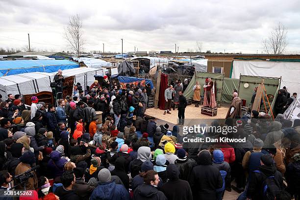 Actors from Shakespeare's Globe perform Hamlet to migrants at the Good Chance Theatre Tent in the Jungle Refugee Camp on February 3, 2016 in Calais,...