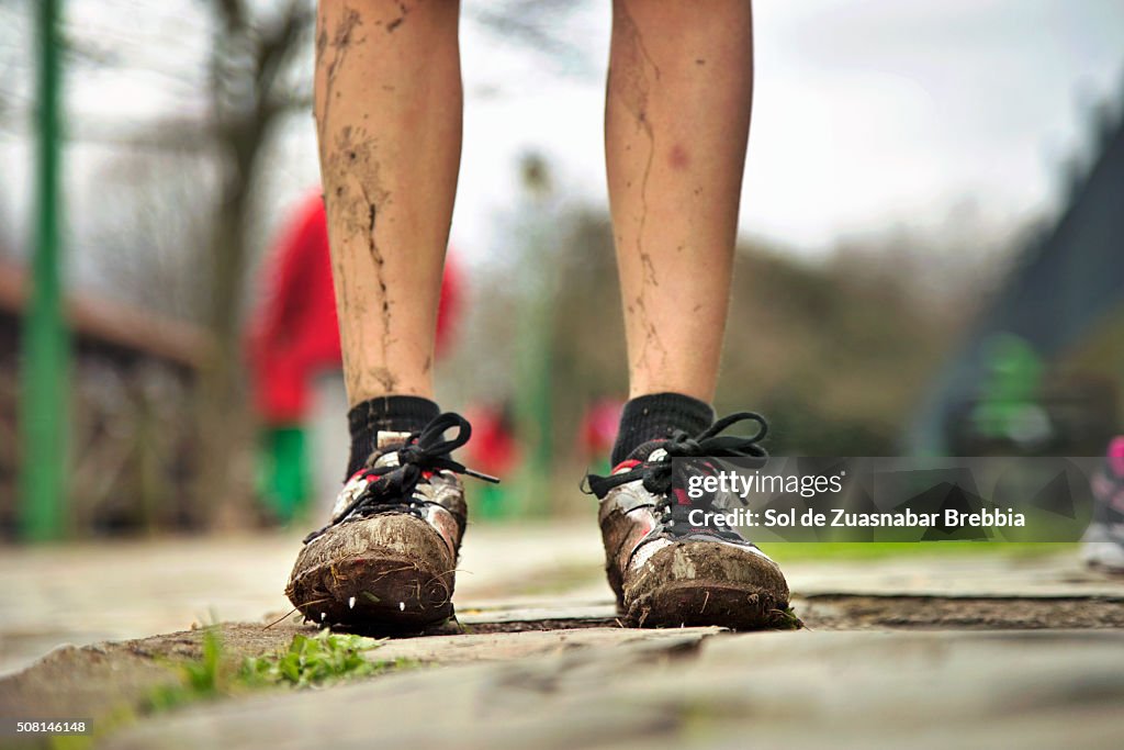 Legs of a girl with mud