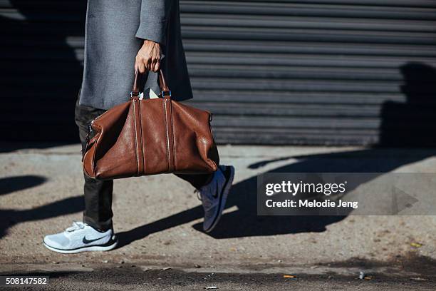 Brown leather duffle/weekender bag seen at Skylight Clarkson Sq during New York Fashion Week: Men's Fall/Winter 2016 on February 2, 2016 in New York...