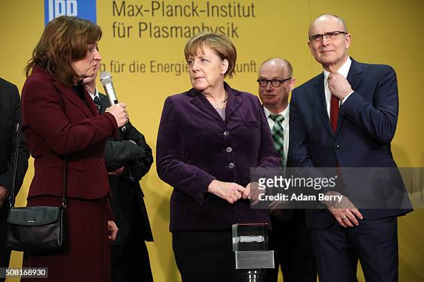 Erwin Sellering, Prime Minister of the German state of Mecklenburg-Vorpommern , German Chancellor Angela Merkel and Sybille Guenter, scientific...