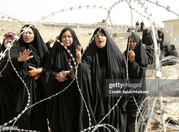 Group of women wait to hear about loved ones imprisoned at Abu Ghraib prison May 9, 2004 in Abu Ghraib, Iraq. U.S. Soldiers and private contractors...