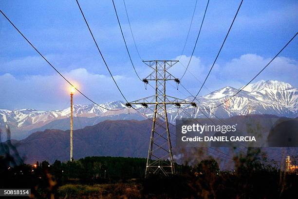 High-tension lines run along the foothills of the Andes, 21 October 2003 on the outskirts of Mendoza, Argentina. The Argentine government will...