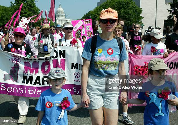 Edith Brashares, of Arlington, Virginia, marches with her daughter Julia Simon and Julia's friend Danica Mooney-Jones at the Million Mom March May 9,...