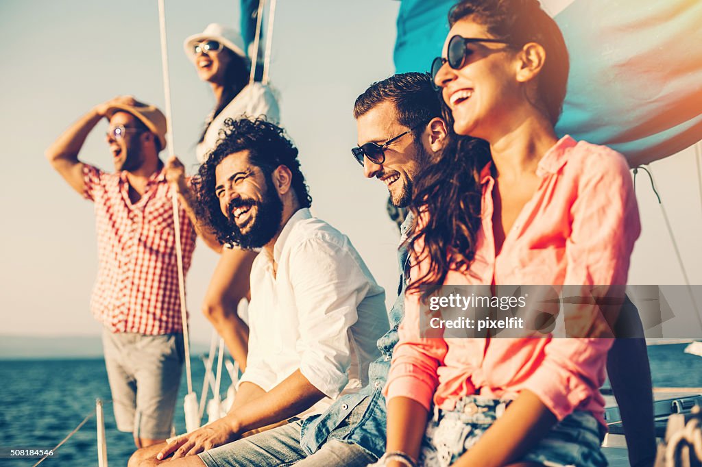 Happy friends on a yacht