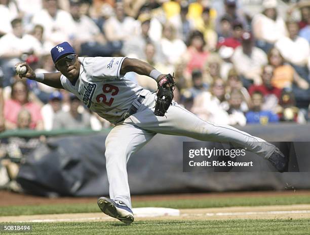 Adrian Beltre of the Los Angeles Dodgers tries to get a throw to first against the Pittsburgh Pirates on May 9, 2004 at PNC Park in Pittsburgh,...