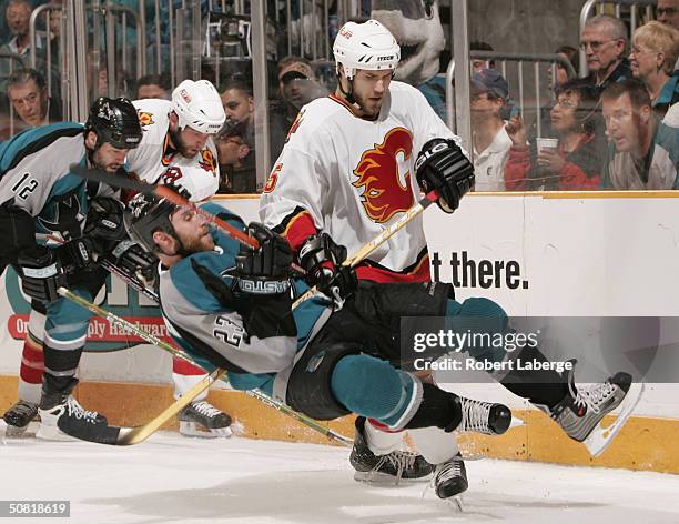 Steve Montador of Calgary Flames takes down Niko Dimitrakos of the San Jose Sharks during Game one of the 2004 NHL Western Conference Finals May 9,...