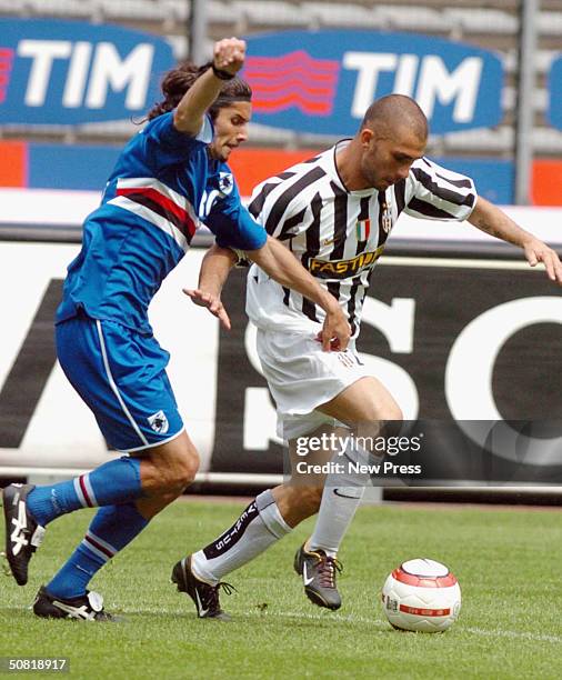 Stefano Sacchetti of Sampdoria clashes with Marco Di Vaio of Juventus after scoring a goal during the Serie A match between Juventus and Sampdoria...