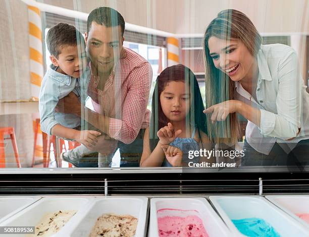 family at an ice cream shop - ice cream parlour stock pictures, royalty-free photos & images