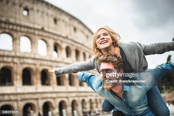 piggybacking for st. valentine in rome - italian people stock pictures, royalty-free photos & images