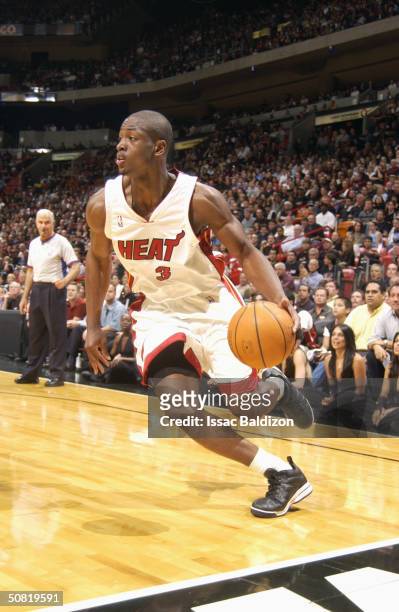 Dwyane Wade of the Miami Heat drives against the New Orleans Hornets in Game 7 of the Eastern Conference quarterfinals during the 2004 NBA Playoffs...