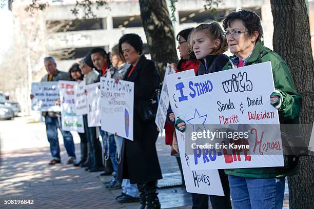 Supporters gather outside as Sandra Merritt, a defendant in a recent indictment reversal stemming from a Planned Parenthood surreptitious video she...