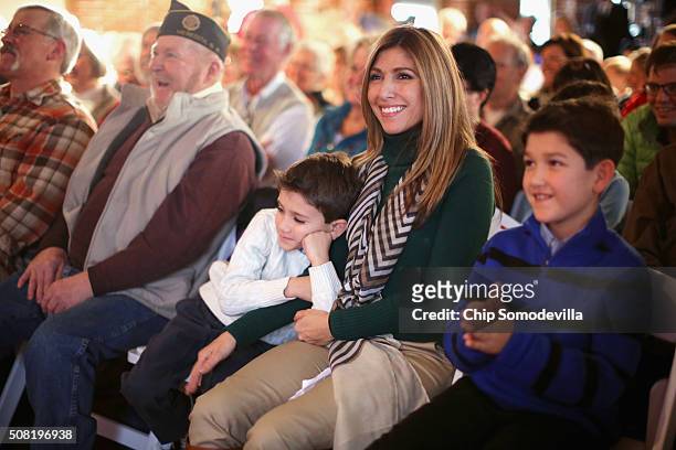 Jeanette Dousdebes Rubio, wife of Republican presidential candidate Sen. Marco Rubio sits inbetween their sons Dominick and Anthony while listening...