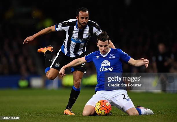 Andros Townsend of Newcastle united challenges Seamus Coleman of Everton during the Barclays Premier League match between Everton and Newcastle...