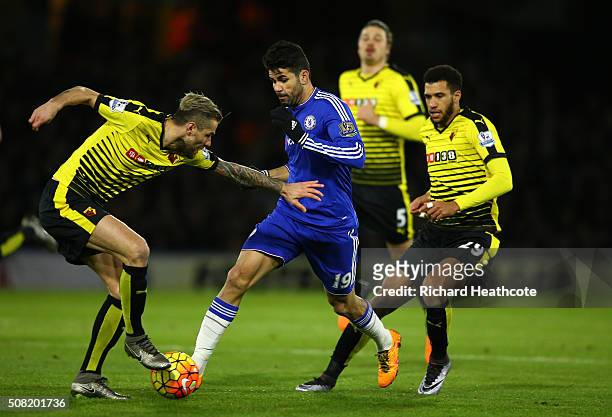 Diego Costa of Chelsea is closed down by Valon Behrami of Watford and Etienne Capoue of Watford during the Barclays Premier League match between...