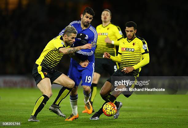 Diego Costa of Chelsea is closed down by Valon Behrami of Watford and Etienne Capoue of Watford during the Barclays Premier League match between...