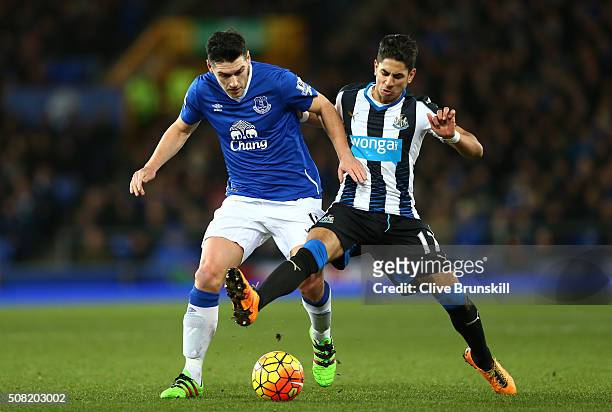 Gareth Barry of Everton and Ayoze Perez of Newcastle United battle for the ball during the Barclays Premier League match between Everton and...