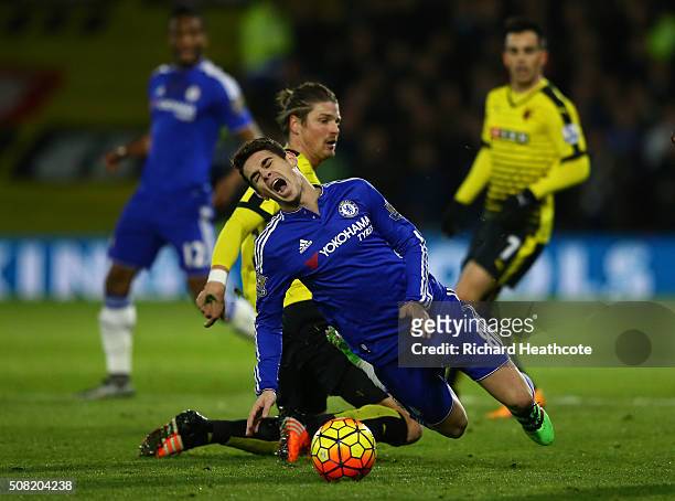 Oscar of Chelsea is brought down by Sebastian Prodl of Watford during the Barclays Premier League match between Watford and Chelsea at Vicarage Road...