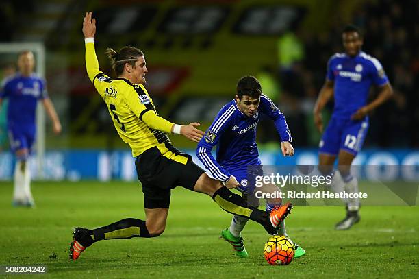 Oscar of Chelsea is brought down by Sebastian Prodl of Watford during the Barclays Premier League match between Watford and Chelsea at Vicarage Road...