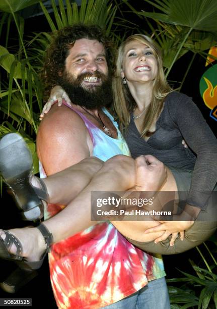 Survivor All-star cast members Rupert Boneham and Jenna Lewis pose for photos after the Survivor All-stars Finale at Madison Square Garden May 9,...