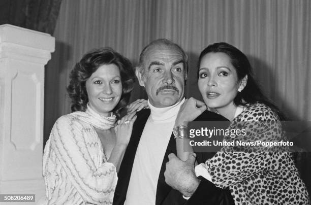 Scottish actor Sean Connery posed with Barbara Carrera and Pamela Salem during a press launch for the James Bond film Never Say Never Again at the...