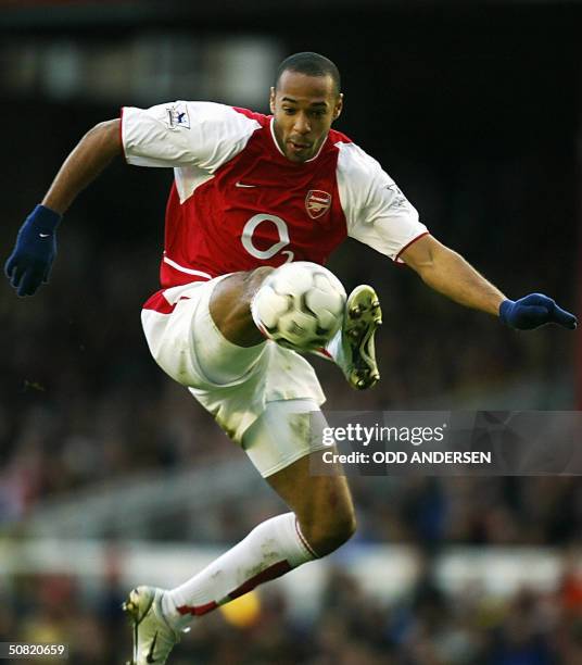 London, UNITED KINGDOM: This file photo shows Arsenal's French forward Thierry Henry controling the ball in play against Bolton during their FA...