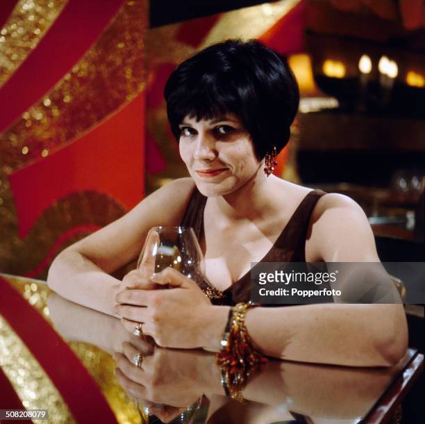 British actress Caroline Mortimer pictured on the set of the television drama series 'Armchair Theatre - The Gong Game' in 1965.